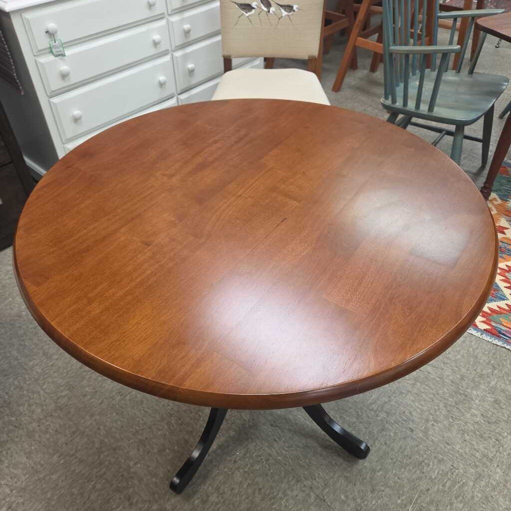 Round Cocktail Table with Pedestal Base - Black and Cherry Finish