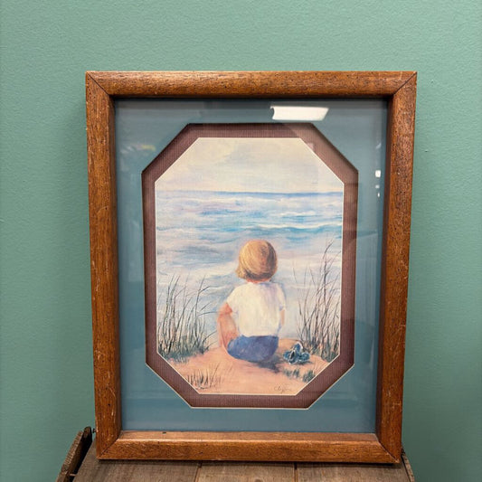 Framed Print of Child by the Ocean
