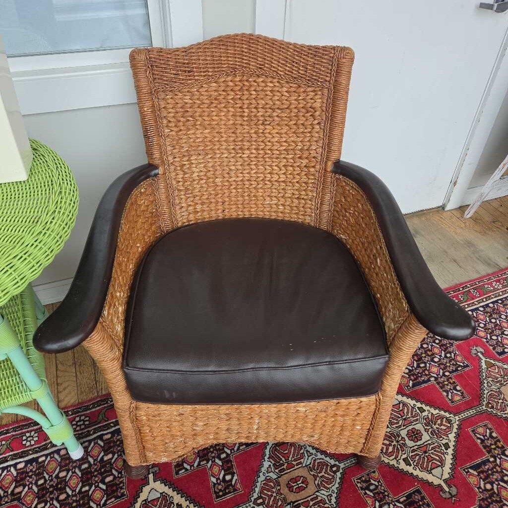 Vintage Wicker Arm Chair with Dark Wood Accents and Brown Leather Cushion